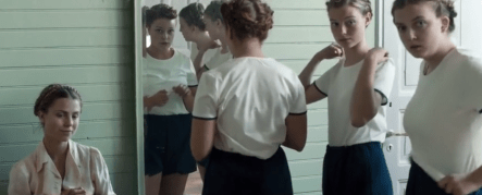 Girls staring in locker room long shot