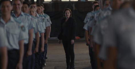 Robin and line of police